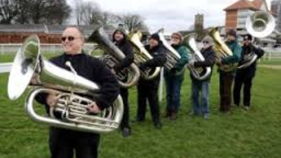 Tuba players warm-up for Tubarama world record attempt