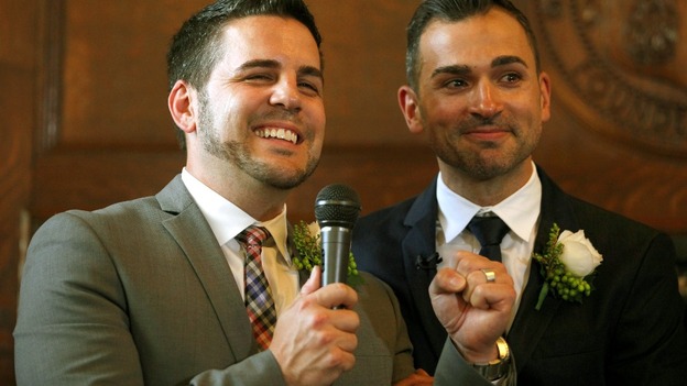 Jeff Zarrillo (L) speaks after getting married to his partner Paul Katami