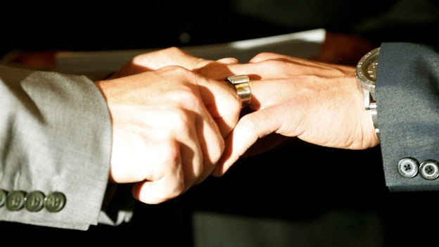 Paul Katami (R) and Jeff Zarrillo exchange wedding rings