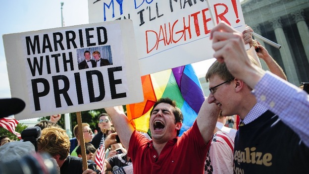 David Baker, 24 of Phoenix, Arizona, celebrates outside the Supreme Court