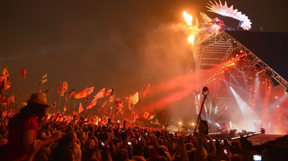 The crowd watch as the Rolling Stones perform on the Pyramid Stage