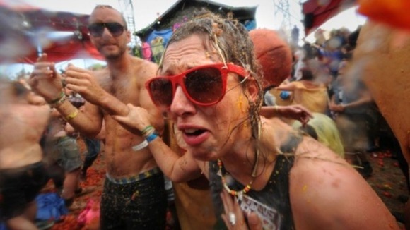 Festival-goers taking part in a giant tomato fight