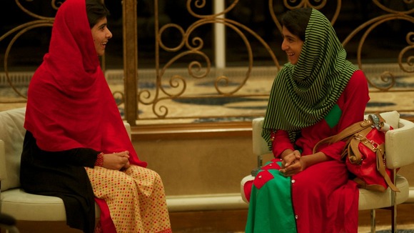 Malala Yousufzai (left) and Shazia Ramzan smile and chat as they are reunited.
