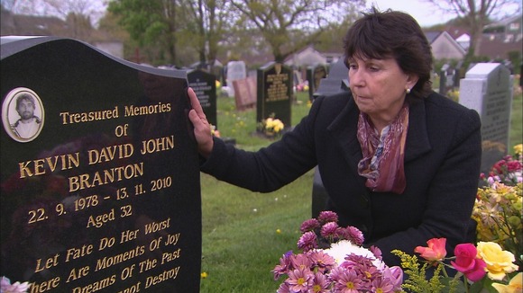 Denise Branton at the grave of her son, Kevin