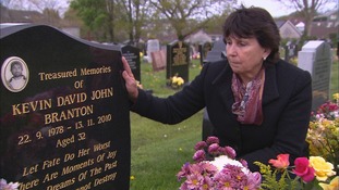 Denise Branton at the grave of her son, Kevin