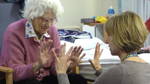 Hospital staff interacting with patient