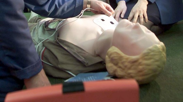 Defibrillator being used on resuscitation dummy