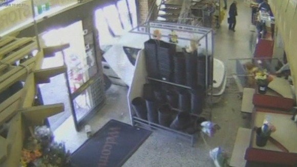 An elderly woman crashes through the front window of a supermarket in Melbourne, Australia.