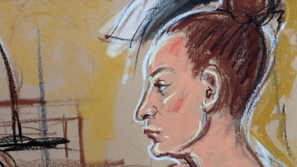 Daniel Pelka's mother looks on as her partner Mariusz Krezolek gives evidence.