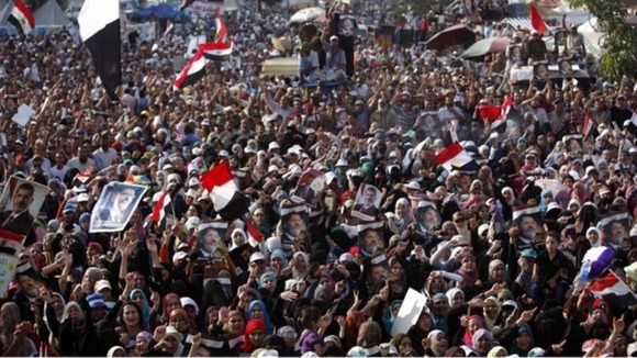 Pro-Morsi supporters shout slogans as they rally at Cairo's Raba El-Adwyia square