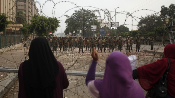 Women supporting the deposed Egyptian President Mohamed Morsi shout at members of the Republican Guard