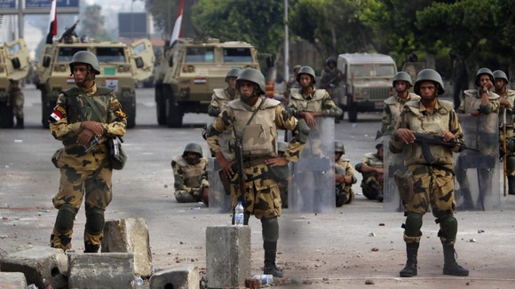 Soldiers on duty outside the Republican Guard headquarters in Cairo