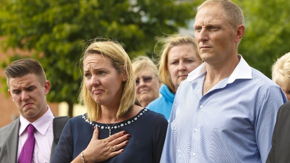 Sergeant Danny Nightingale with wife Sally speaks to the media outside the court
