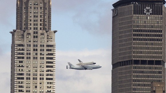 The shuttle is flown across New York.