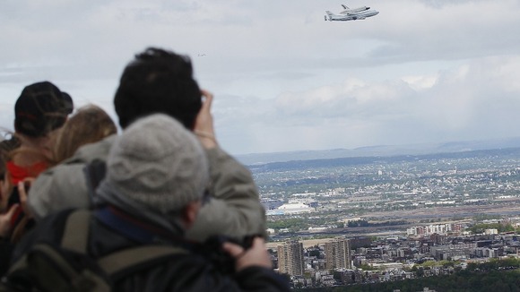Spectators watch Enterprise's final flight.