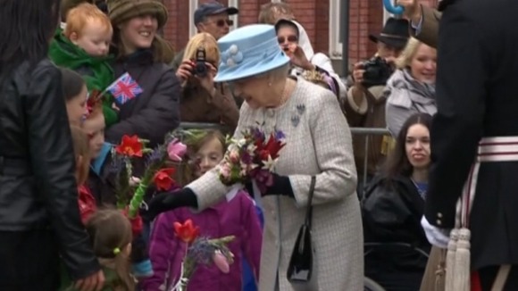 The Queen receiving flowers