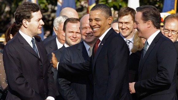 US President Barack Obama pats Chancellor George Osborne on the arm