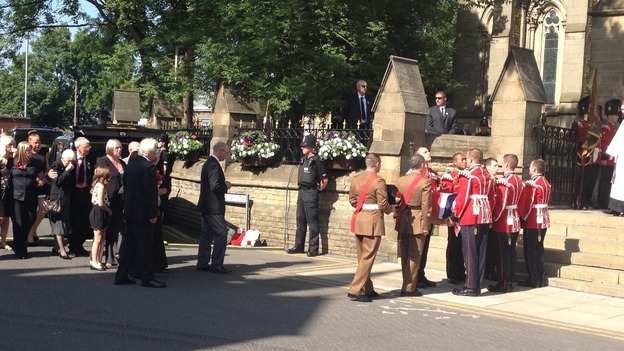 The coffin of Fusilier Rigby is carried into Bury Parish Church ahead of a vigil
