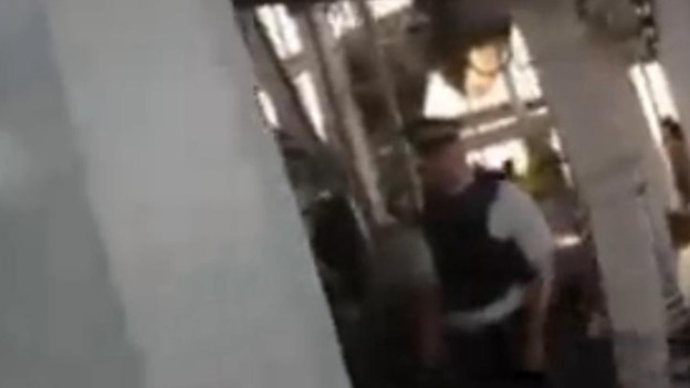 A police officer is seen in the live video feed from a headcam worn by one of the climbers