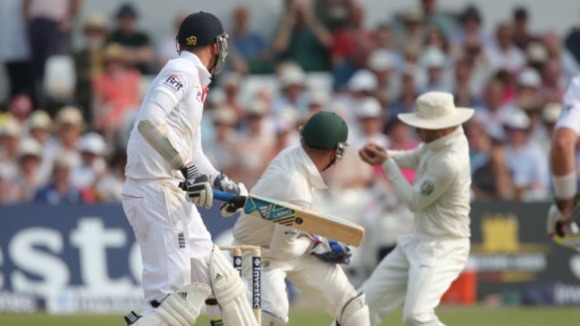 Stuart Broad looks on as he appears to have been caught