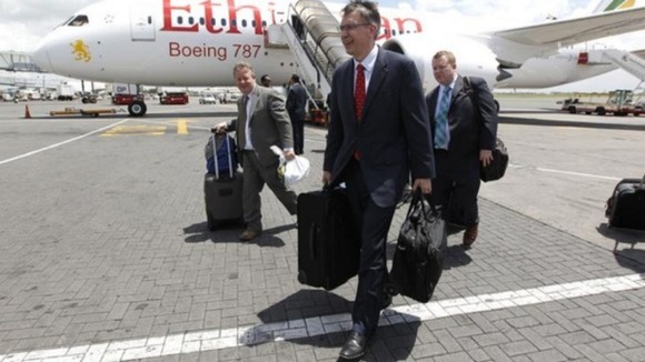 Randy Tinseth, Vice President of marketing for Boeing (front), walks from an Ethiopian Airlines' 787 Dreamliner after it lands in Nairobi