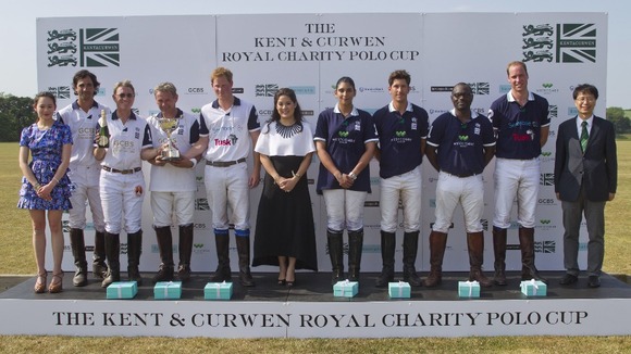 The polo teams in The Kent & Curwen Royal Charity Polo Cup with the Duke of Cambridge (2nd right) and Prince Harry (5th left).