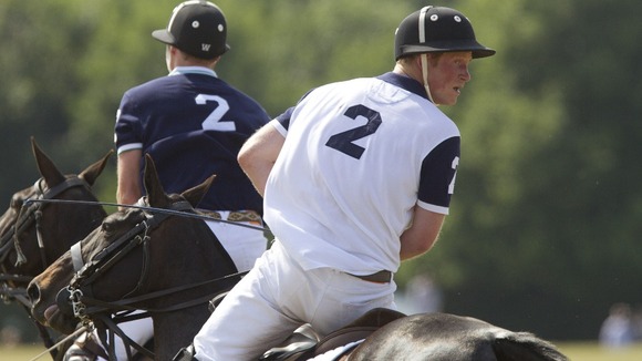 The Duke of Cambridge (left) and Prince Harry (right) playing polo against one another.