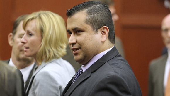 George Zimmerman raises a smile after the verdict is read out in court.