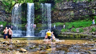 People stood in waterfall