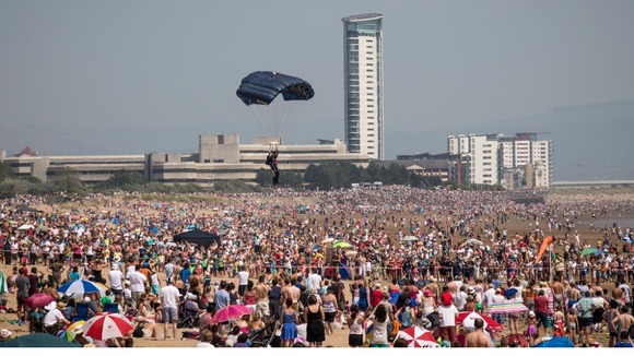 Parachutist tries to find space on beach to land