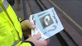 Police hand out posters
