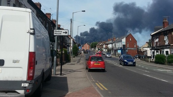 The plume of smoke can be seen from several miles away
