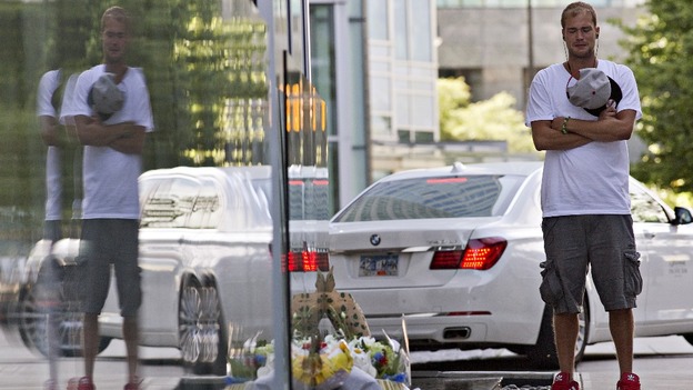 Richard Monteith, cousin of Canadian actor Cory Monteith, pauses at a small memorial outside the hotel in Vancouver.