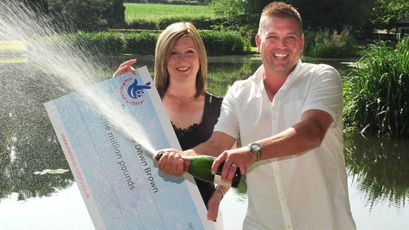 David and Dawn with their million pound cheque