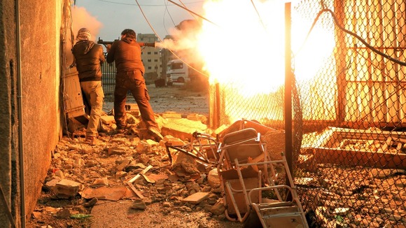 Members of the Free Syrian Army battle against government forces.