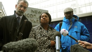 Doreen Lawrence with her son Stuart, and lawyer Imran Khan, talks to the media outside court on June 28.