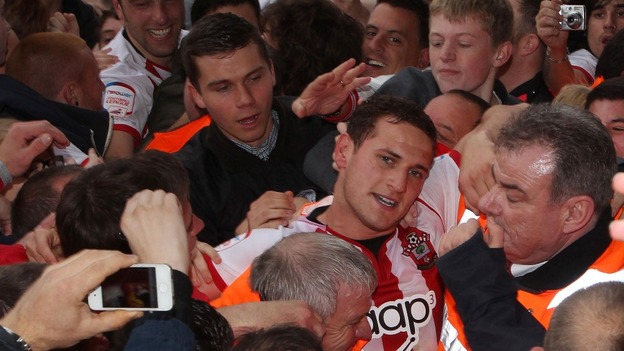Southampton's Billy Sharp of is helped down the tunnel by stewards at end of game during Football League Championship match
