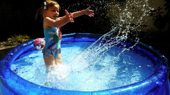 Four year old Kadie Lane cools down in Whitley Bay.