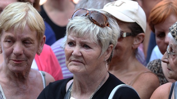Mourners pay their respects