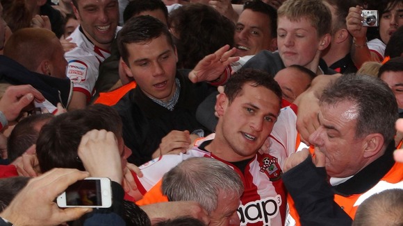 Southampton Billy Sharp of is helped down the tunnel by stewards at the end of the game.