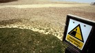 A warning sign on the bank of Bewl reservoir, Kent.