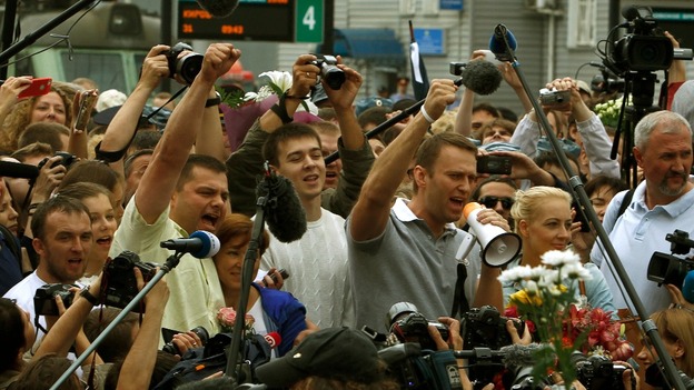 Alexei Navalny speaks to reporters in Moscow after he was released from jail