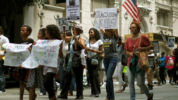 Protesters march during a demonstration against the verdict in the George Zimmerman trial, in Los Angeles.