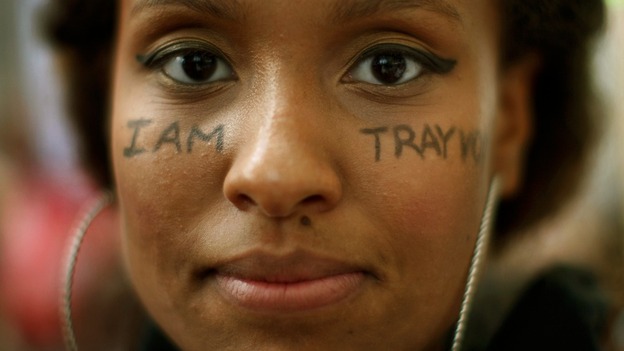 The message 'I am Trayvon' is displayed on the face of Keesha Clark during a march in Los Angeles.