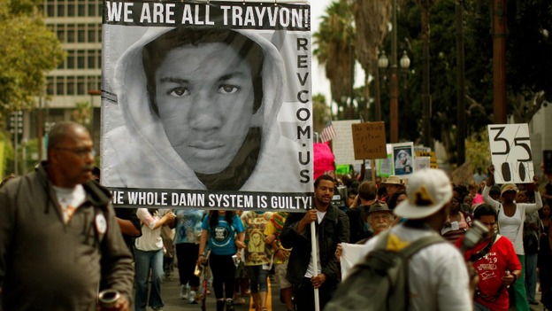 People carry a photo of Trayvon Martin during the Los Angeles march.