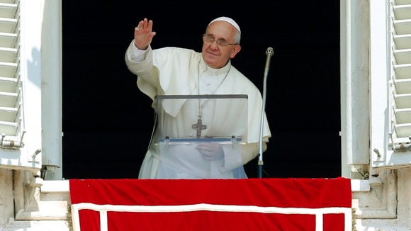 Pope Francis waved as he led prayers in Saint Peter's Square he is due to arrive in Rio today.