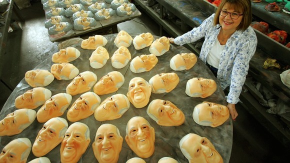 Mask in honor of Pope Francisco, is displayed in a factory in Rio de Janeiro.