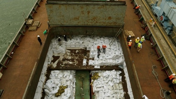 Bags labelled "Cuban Raw Sugar" are seen inside the Chong Chon Gang.