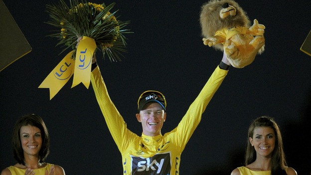 Chris Froome takes to the podium after winning the Tour de France.