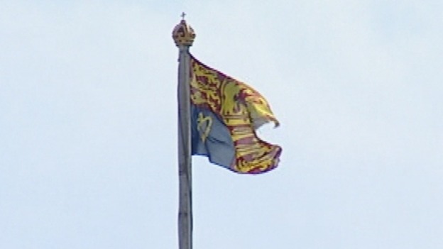 The Royal Standard is flying above Buckingham Palace.